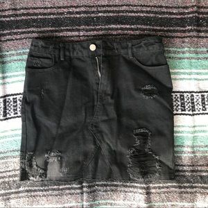 Distressed black denim skirt